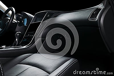 Modern Luxury car inside. Interior of prestige modern car. Comfortable leather seats. Black perforated leather cockpit. Steering w Stock Photo