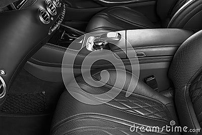 Modern Luxury car inside. Interior of prestige modern car. Comfortable leather seats. Perforated leather with Black backg Stock Photo