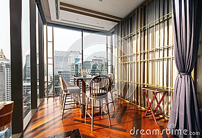 Modern luxury decorated interior restaurant that can view Bangkok cityscape. Elegant design for fine dining Editorial Stock Photo