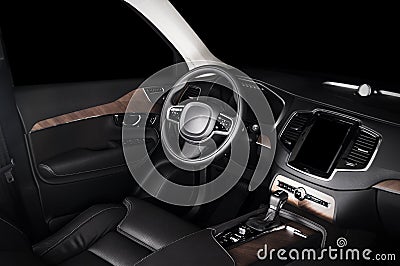 Modern luxury prestige car interior, dashboard, wood panels, steering wheel. Stock Photo