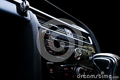 Modern Luxury sport car inside. Interior of prestige car. Black Leather. Car detailing. Dashboard. Media, climate and navigation c Stock Photo