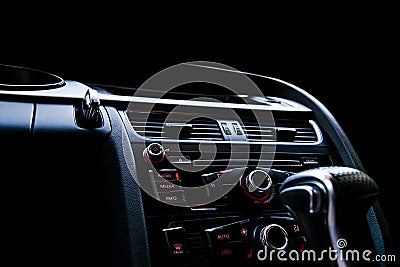 Modern Luxury sport car inside. Interior of prestige car. Black Leather. Car detailing. Dashboard. Media, climate and navigation c Stock Photo