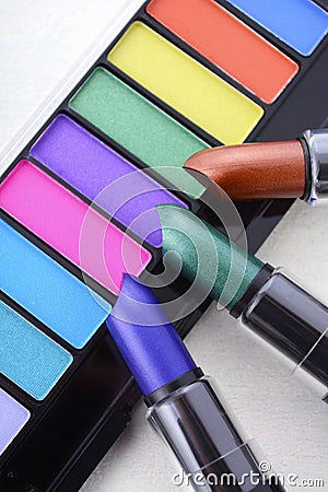 Modern makeup lipstick and eye shadow color range. Stock Photo