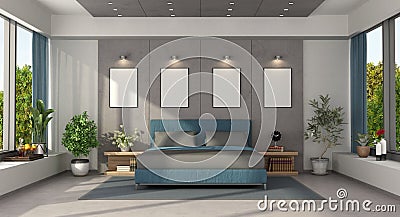 Modern master bedroom with blue double bed Stock Photo