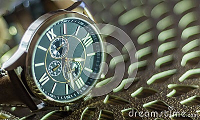 Modern men`s watch, brown-gold color in close up shot Stock Photo