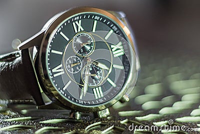 Modern men`s watch, brown-gold color in close up shot Stock Photo