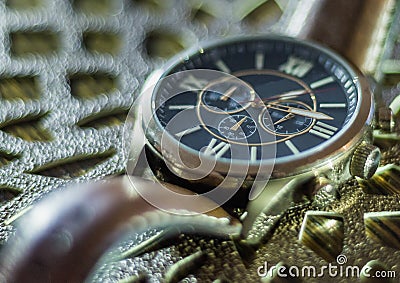 Modern men`s watch, brown-gold color in close up shot Stock Photo