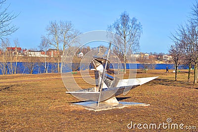 Modern metal statue of a fisherman in a boat. Editorial Stock Photo
