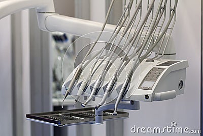 Modern metallic dentist tools and burnishers on a dentist chair in dentist clinic Stock Photo