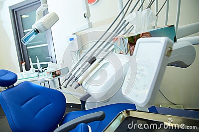 Modern metallic dentist tools and burnishers on a dentist chair in Dentist Clinic. Stock Photo