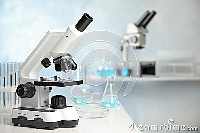 Modern microscope on table in laboratory. Medical equipment Stock Photo