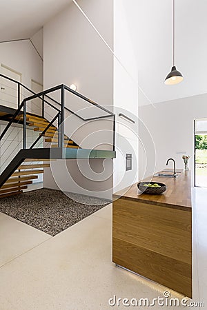 Modern minimalist kitchen and staircase Stock Photo