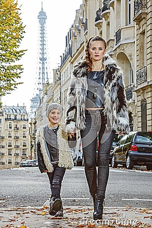 Modern mother and daughter in Paris, France going forward Stock Photo