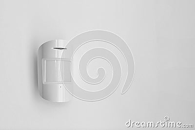 Modern motion sensor indoors Stock Photo