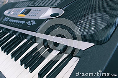 Close-up of a musical electronic synthesizer and its keys with a speaker Stock Photo