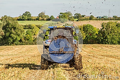 Modern New Holland tractor Tractor spreading manure on fields Editorial Stock Photo