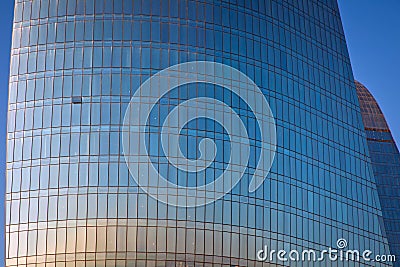 Modern office building detail, glass surface Clouds Reflected in Windows of Modern Office Building. Building glass . Clouds Reflec Stock Photo