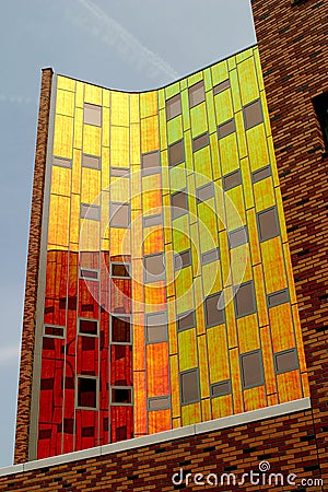 A modern office-building, equipped with coloured reflecting wall Stock Photo