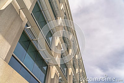 Modern office building exterior viewed against cloudy sky on a sunny day Stock Photo