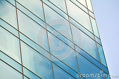 Modern office building facade abstract fragment, shiny windows in steel structure. Stock Photo