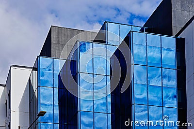 Modern Office Buildings, Blue Sky Reflected in Glass facades Stock Photo