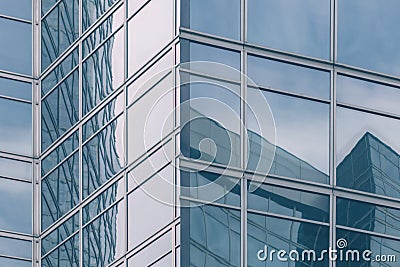 Modern office glass building texture in light blue tones for business background, business center generic facade, corner view Stock Photo