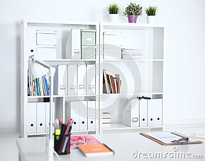 Modern office interior with tables, chairs and bookcases Stock Photo