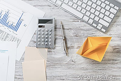 Modern office workspace with yellow paper ship Stock Photo