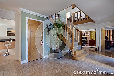 Modern open entrance hall with stairs and tiled floor Editorial Stock Photo