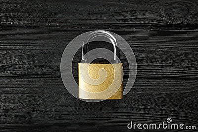 Modern padlock on black wooden table, top view Stock Photo