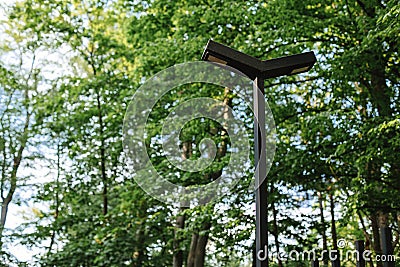 Modern park lighting lantern near the fence. Solar batteries, phone charging and modern technology in the park forest Stock Photo