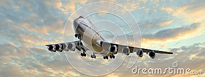 Modern Passenger airplane flight in the sunset panorama Stock Photo