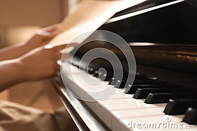 Modern piano with black and white keys, closeup. Space for text Stock Photo