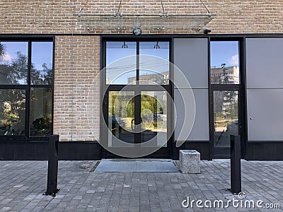 Modern real estate, residential apartment building, entrance with glass canopy door Stock Photo