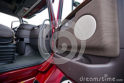 Modern red semi truck brown interior gorgeous place to work Stock Photo