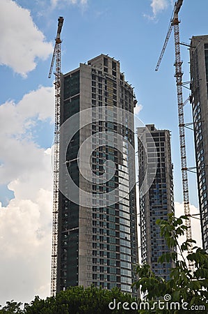 Modern residence construction and tower cranes Stock Photo