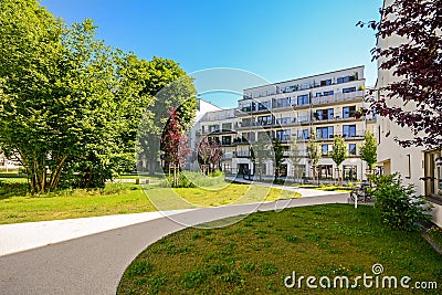 Modern residential buildings in a green environment, sustainable urban planning Stock Photo