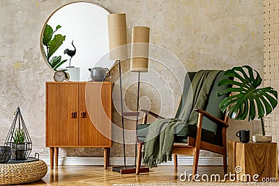 Modern retro composition of living room interior with vintage armchair, lamp, commode, tropical leaf, plant, decoration. Stock Photo