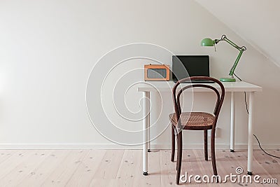 Modern retro minimalist workspace in a simple home office room. Stock Photo