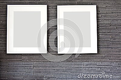 Living room wall design with modern slates texture and two frames. Stock Photo