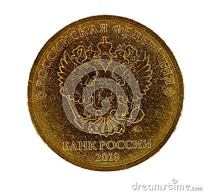 Modern russian coin of golden alloy. Revers seal of Bank of Russia depicting two-headed eagle heraldic signs of Russian Empire. Stock Photo