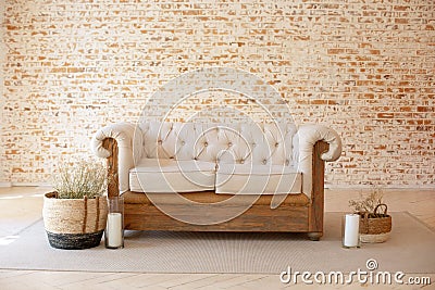 Modern Rustic living room interior with white sofa and wicker baskets with dried flowers. Cozy interior home design. Autumn room d Stock Photo