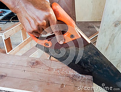 Modern sawing with manual saw Stock Photo