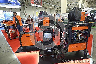 Modern semi automatic welding machines, inverters, plasma cutters Jasic presented on stands in the exhibition hall. Editorial Stock Photo