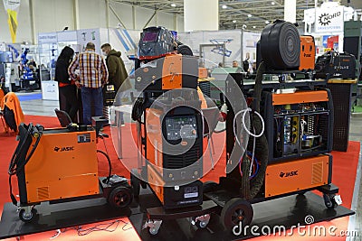 Modern semi automatic welding machines, inverters, plasma cutters Jasic presented on stands in the exhibition hall Editorial Stock Photo