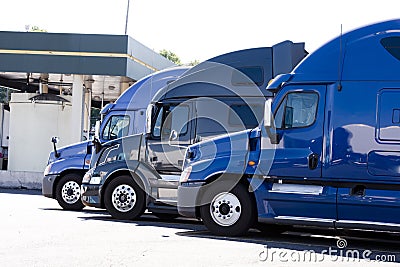 Modern semi trucks profiles on truck stop Stock Photo