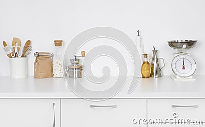 Modern simple kitchen counter interior with kitchenware on white background Stock Photo