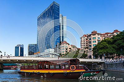 Modern Singapore cityscape with historic boat cruise Editorial Stock Photo