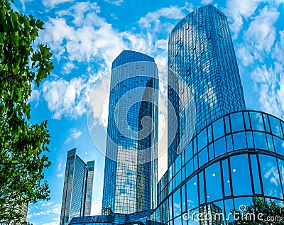 Modern skyscrapers in business district against blue sky Stock Photo