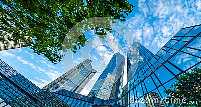 Modern skyscrapers in business district against blue sky Stock Photo